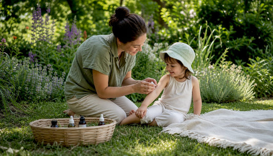 Mother applying mosquito repellent on toddler outdoors