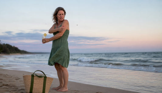 Mosquito approaching woman outdoors at dusk