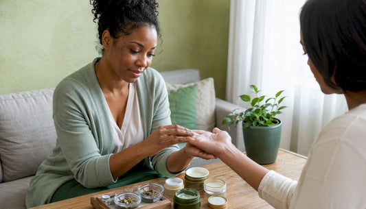 Skin consultant applying moisturizer on dry cracked hand